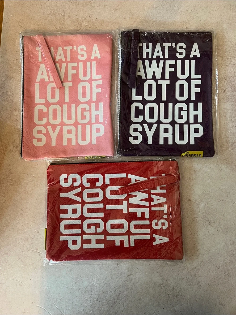 That’s A Awful Lot of Cough Syrup Money Bags. Pink, Purple or Red.